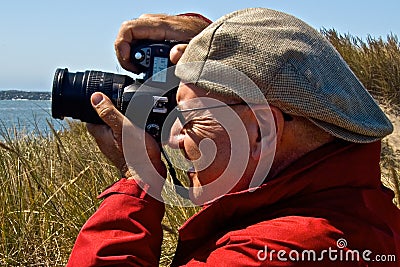 Male Photographer Wearing Cap Backwards Stock Photo