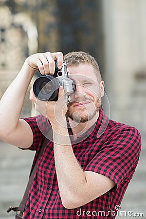 Male Photographer Working In Street Stock Photo