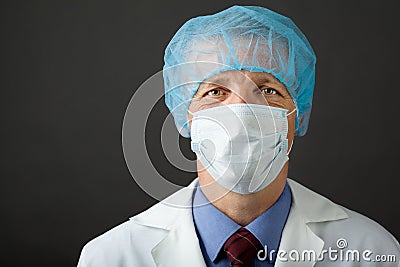 Male physician in mask and cap Stock Photo