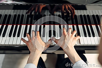 Male pianist hands on grand piano keyboard Stock Photo