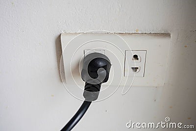 A male plug that is plugged into a female plug. Stock Photo