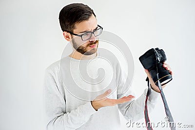 Male potographer thinking Stock Photo