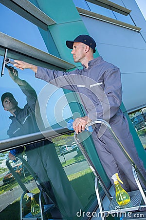 male professional window cleaner Stock Photo