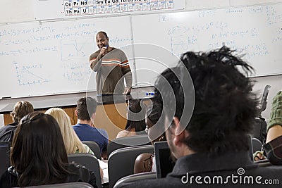 Male Professor Teaching Students Stock Photo