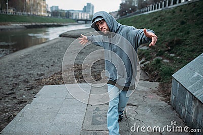 Male rapper posing on the street, urban dancing Stock Photo