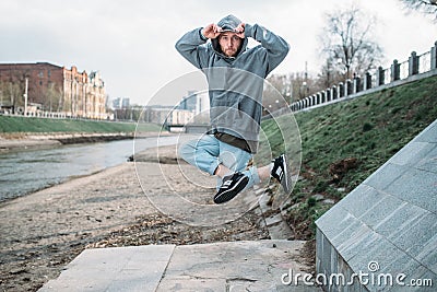 Male rapper posing on the street, urban dancing Stock Photo