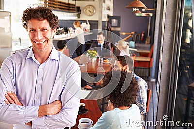 Male restaurant owner, portrait with arms crossed Stock Photo