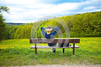 Male resting on the bench Stock Photo