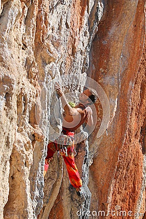 Rock climber leaging climbing route on natural rock Editorial Stock Photo