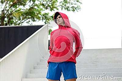 Male runner doing stretching exercise, Stock Photo