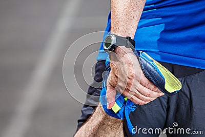 Male runner stretching Stock Photo