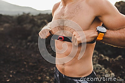 Athlete runner wearing chest heart rate monitor Stock Photo