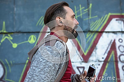 Male running and listening to music on cell phone. Stock Photo