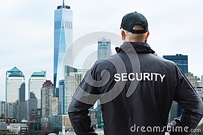 Male Security Guard Looking At City Skyline In Manhattan Editorial Stock Photo