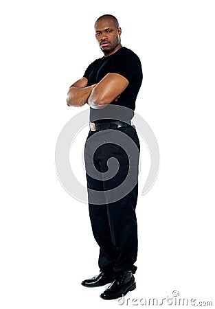 Male security guard with strong arms crossed Stock Photo