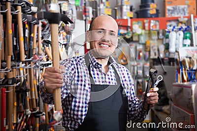 Male seller offering hammer Stock Photo