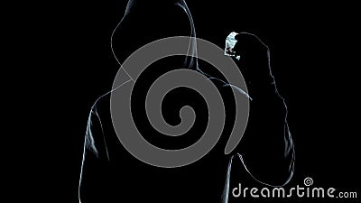 Male silhouette holding packet with pills, drug trafficking crime, lifestyle Stock Photo