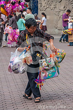 Male snack vendor outside Chongqing Zoo, China Editorial Stock Photo