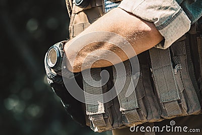 Male soldier wearing a bulletproof vest and a shirt with short sleeves. Stock Photo