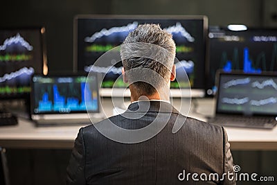 Rear View Of A Male Stock Market Broker Stock Photo