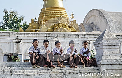 A male student resting at Shwe Yan Pe Temple School, an ancient teak temple in Nyaung Shwe, Myanmar Editorial Stock Photo