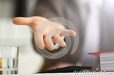 Male in suit and tie offer helping arm closeup Stock Photo