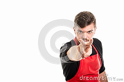 Male supermarket employer showing watching you gesture Stock Photo