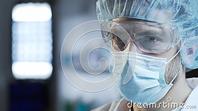 Male surgeon preparing for complex operation, medicine of future, closeup Stock Photo