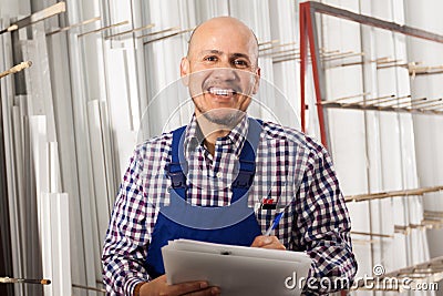 Male surveyor in coverall doing inspection and checking papers Stock Photo