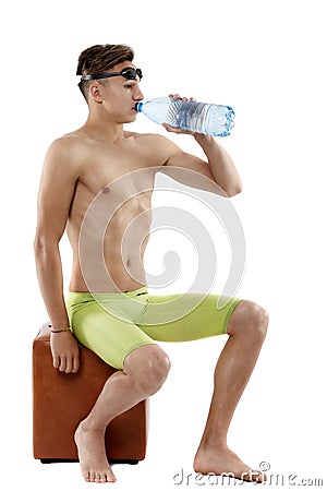 Male swimmer drinking water Stock Photo