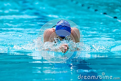 Male swimmer working on his breaststroke swimming at a local po Stock Photo