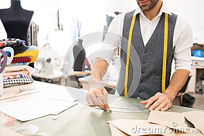 Male Tailor Making Patterns Stock Photo