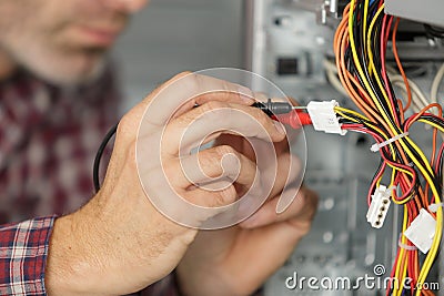 Male technician checking cables computer Stock Photo