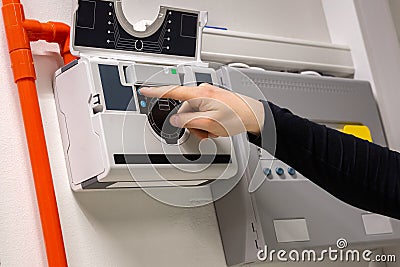 Male Technician Checking Smoke Sensor In Datacenter Stock Photo