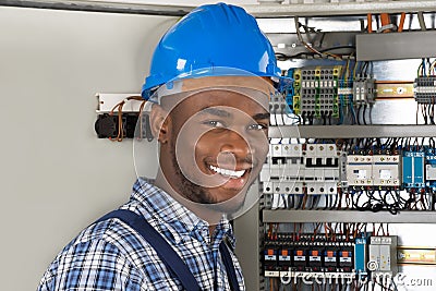 Male Technician Holding Clipboard Stock Photo