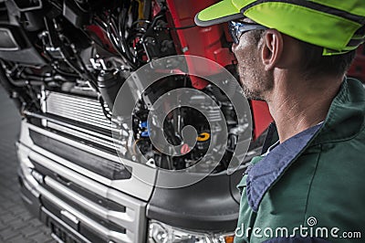 Auto Mechanic Looking Under Hood Of Car Stock Photo