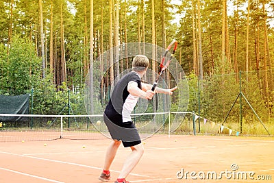 Male tennis player during individual training Stock Photo