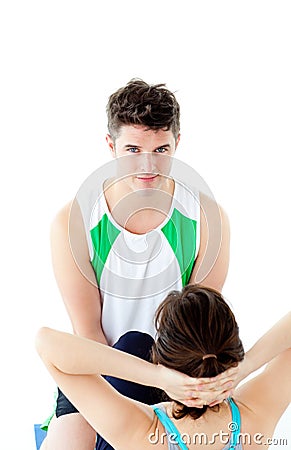 Male therapist doing fitness exercises with woman Stock Photo