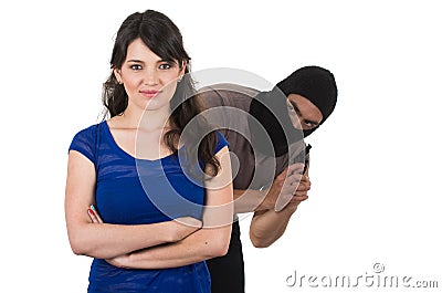 Male thief with gun ready to rob young girl Stock Photo