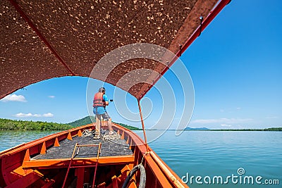 Male Tourism Taking Selfie Picture on the Boat Traveling in the Sea Stock Photo