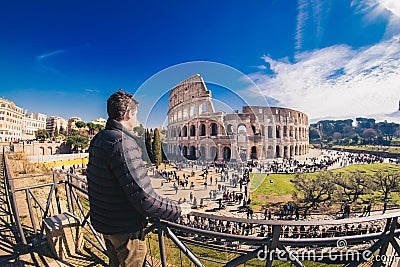Male tourist enjyoing the view at the Colosseum in Rome, Italy Editorial Stock Photo