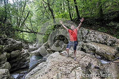 A male traveler admires the canyon of the Agura River in Sochi Stock Photo