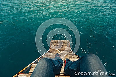 Male Traveler Sitting On Pier With Summer Sea View. Travel Lifestyle Adventure Vacations Concept Stock Photo