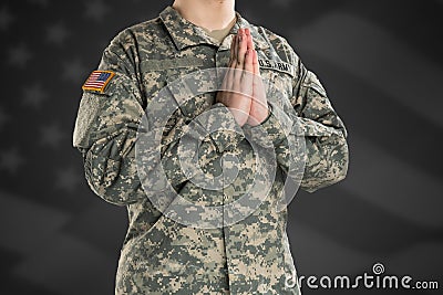 Male in US Army soldier uniform praying Editorial Stock Photo