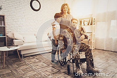 Male Veteran In Wheelchair Homecoming Concept. Stock Photo