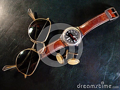 Male watch, cuff buttons and sunglasses Stock Photo