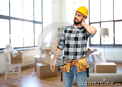 male worker or builder with neck pain at home Stock Photo