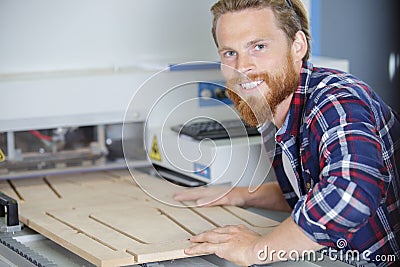 Male worker printing wood cutter Stock Photo