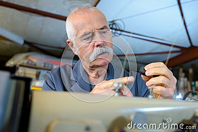 male worker repairing cords Stock Photo