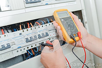 Male worker testing electric current Stock Photo